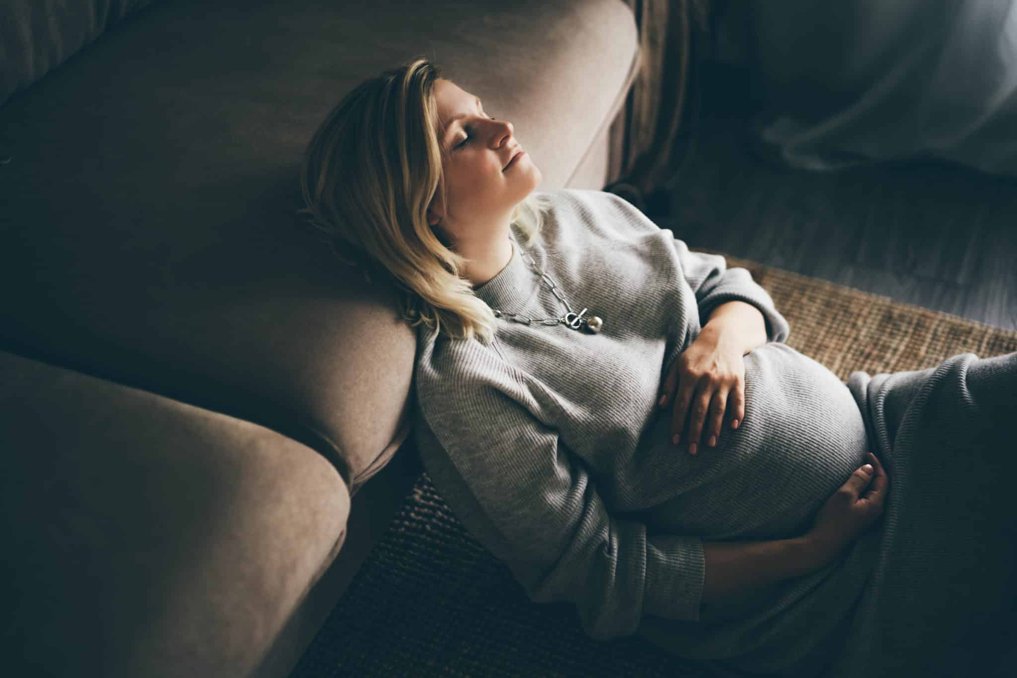 Cozy portrait of a pregnant woman resting at home | What You Need to Know About Getting Divorced While Pregnant